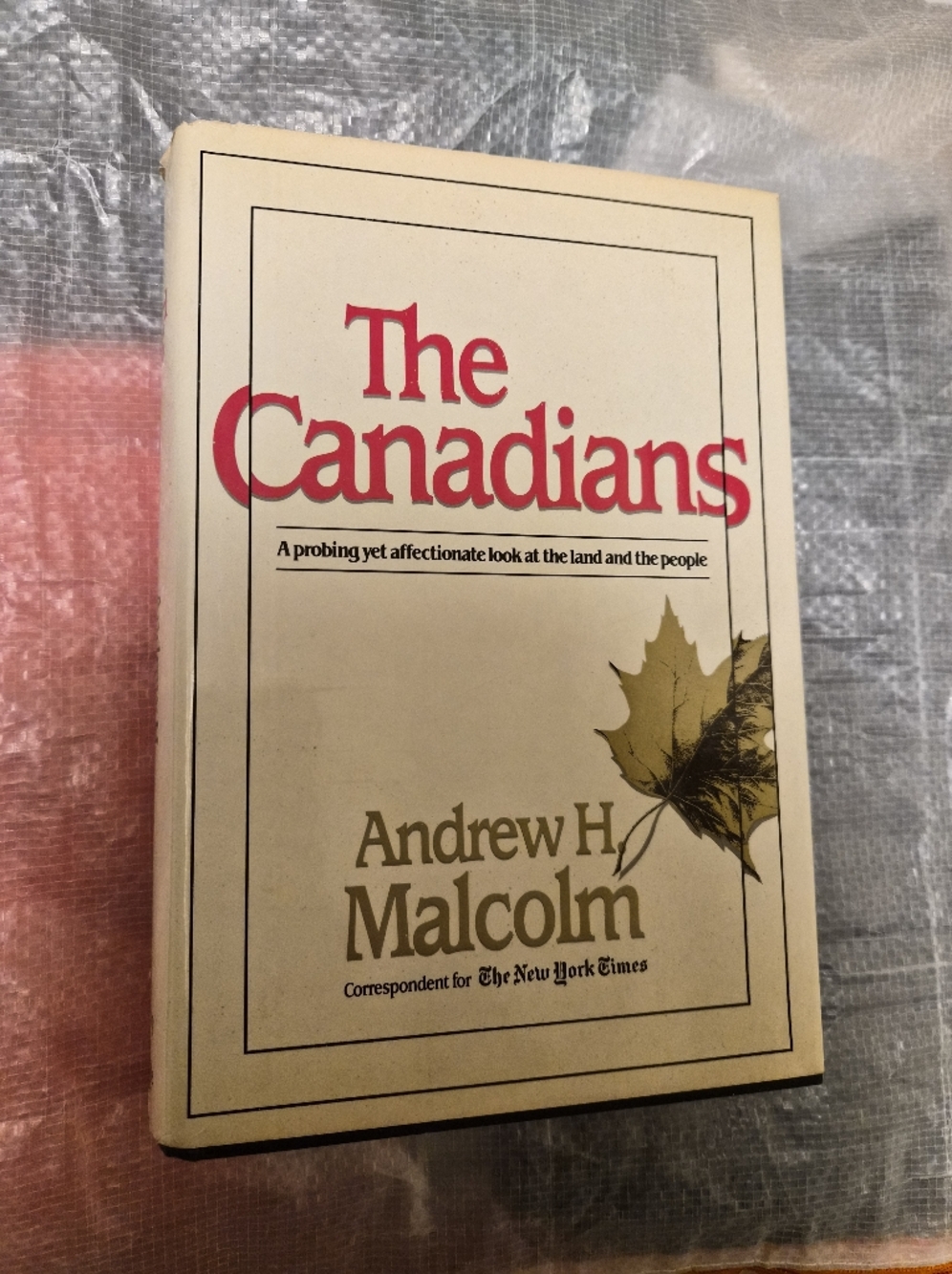 The Canadians by Andrew H. Malcolm - Cream Cover with Red Title